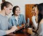 Group of students, studying, over coffee with technology