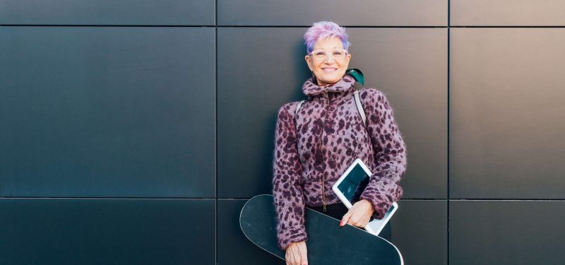 Trendy grandmother with skateboard