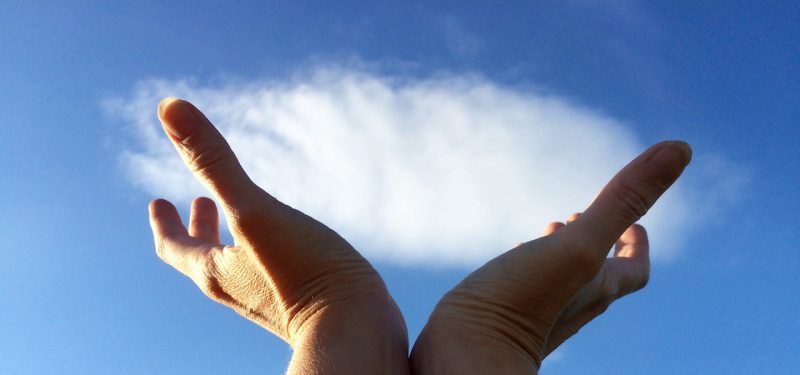 Hands holding a cloud