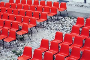 Rows of empty red chairs